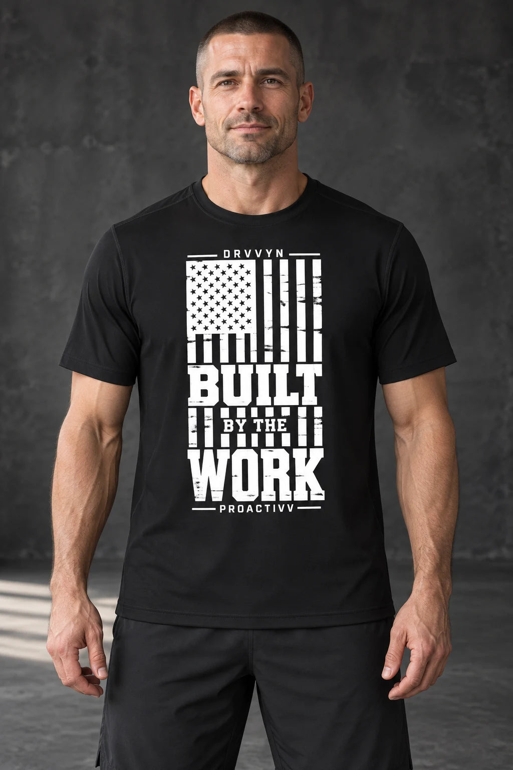 DRVVYN Proactivv Built By The Work — mens performance tee, front view on model