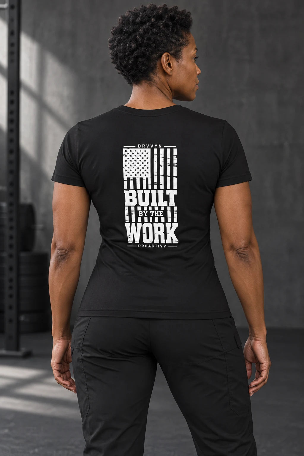 DRVVYN Proactivv Built By The Work — womens performance tee, back view on model