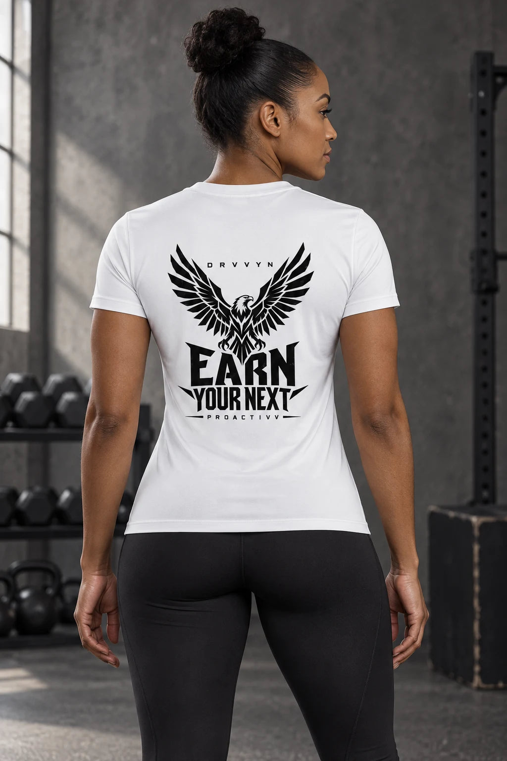 DRVVYN Proactivv Earn Your Next — White fitted performance tee with black eagle back print, female model