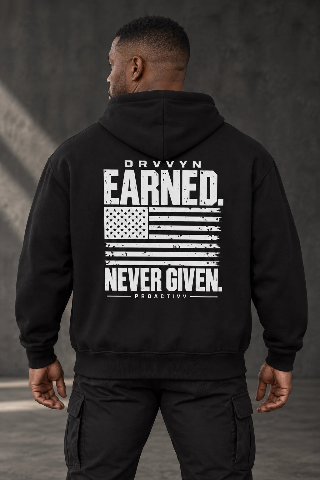 DRVVYN Proactivv Earned Never Given — mens hoodie, back view on model