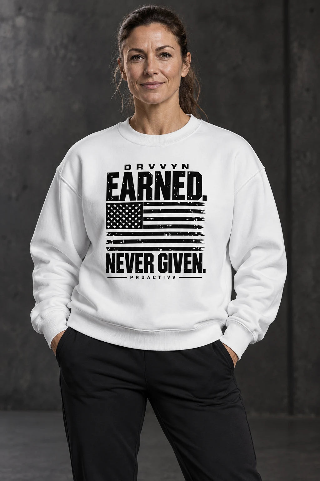 DRVVYN Proactivv Earned Never Given — unisex crewneck, front view on model